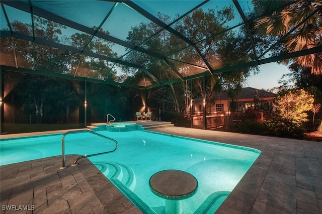 view of swimming pool with a patio area and a pool with connected hot tub