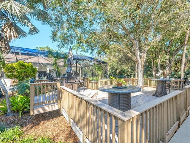 wooden terrace featuring outdoor dining space