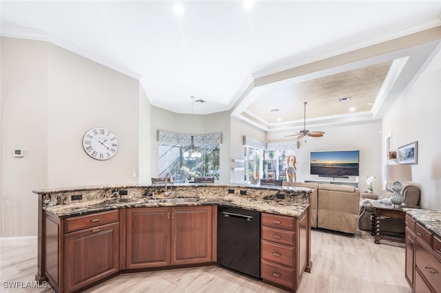 kitchen with light stone counters, a sink, black dishwasher, open floor plan, and ornamental molding