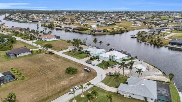 birds eye view of property featuring a residential view and a water view