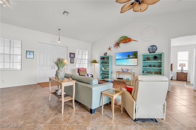 living area featuring visible vents, a ceiling fan, and light tile patterned flooring