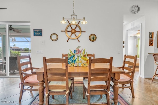 dining area featuring visible vents, ceiling fan, baseboards, and light tile patterned floors