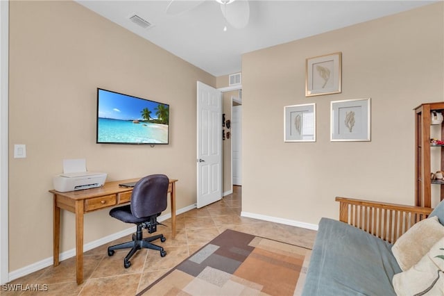 office with light tile patterned floors, a ceiling fan, visible vents, and baseboards