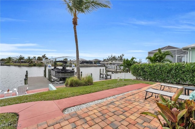 view of patio / terrace featuring a water view, boat lift, and a boat dock