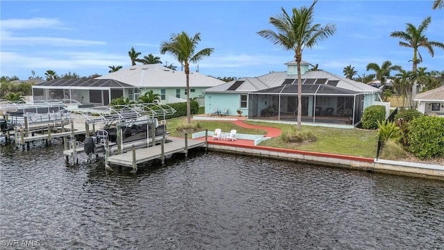 dock area with a lanai, a water view, and boat lift