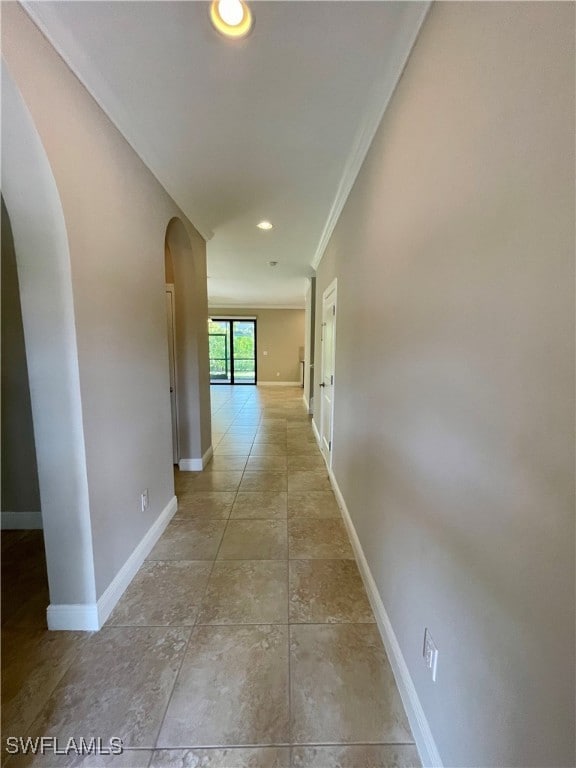 corridor featuring ornamental molding