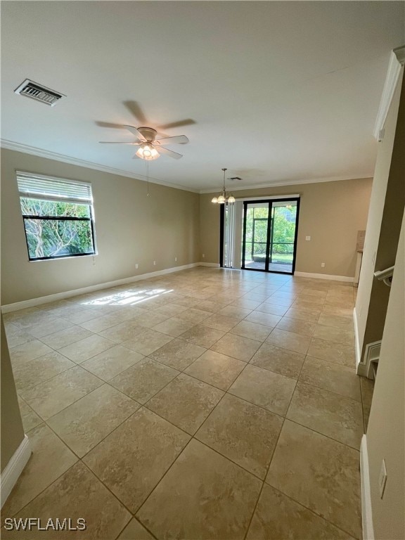 unfurnished room featuring ceiling fan with notable chandelier and ornamental molding