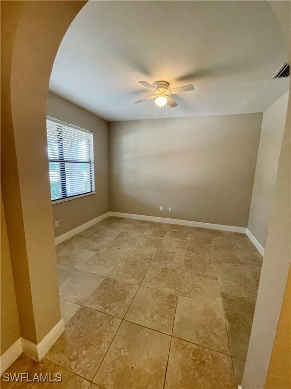 spare room with ceiling fan