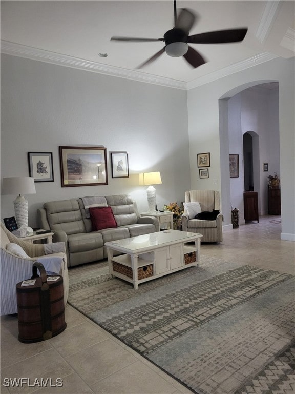 tiled living room featuring crown molding and ceiling fan