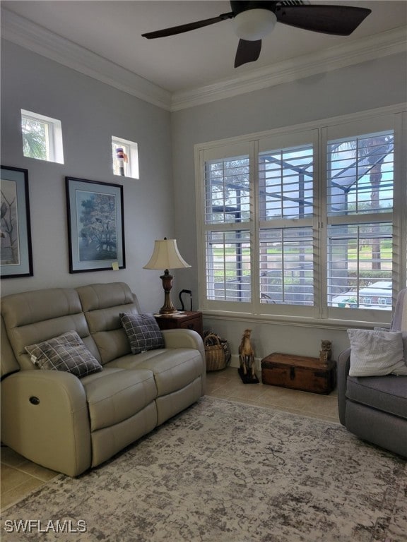 living room featuring tile patterned floors, ceiling fan, and crown molding