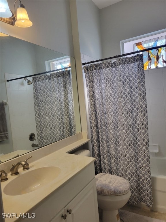 full bathroom featuring vanity, toilet, and shower / bathtub combination with curtain