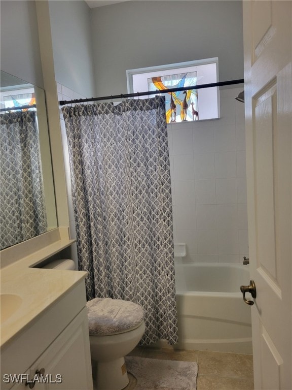 full bathroom featuring tile patterned flooring, vanity, toilet, and shower / bath combo with shower curtain