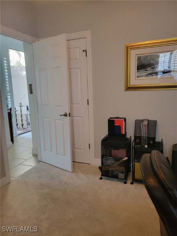 living area featuring light colored carpet