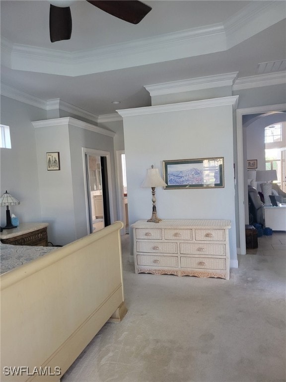 bedroom featuring light colored carpet, ceiling fan, and crown molding