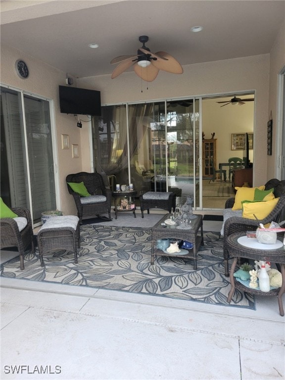 view of patio featuring outdoor lounge area and ceiling fan