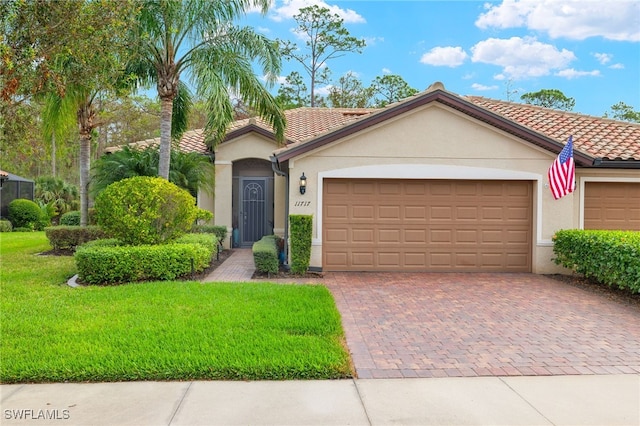 view of front facade featuring a front yard and a garage