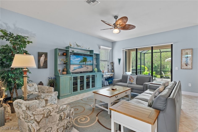 tiled living room with ceiling fan