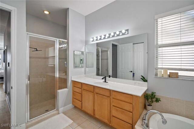 2007 Jacklin Ct, Naples, FL 34120 - full bath with a stall shower, vanity, tile patterned floors, and a bath