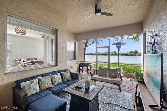 sunroom with a ceiling fan