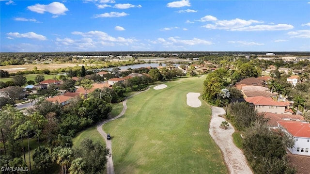 drone / aerial view with golf course view and a residential view