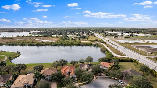 bird's eye view with a water view and a residential view