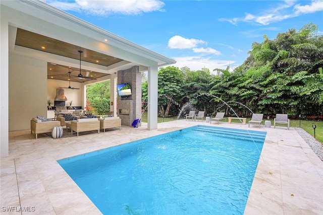 view of pool featuring outdoor lounge area, ceiling fan, and a patio area