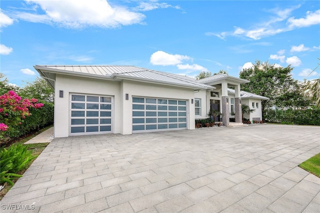 prairie-style house featuring a garage