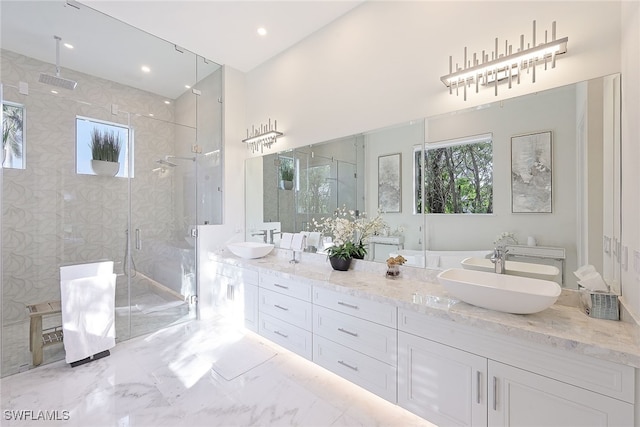 bathroom featuring vanity and an enclosed shower