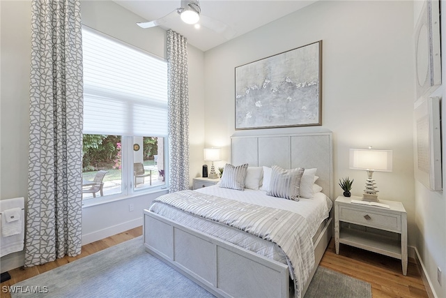 bedroom with ceiling fan and light wood-type flooring