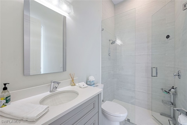 bathroom featuring vanity, toilet, and walk in shower