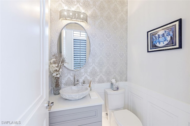 bathroom with vanity and toilet