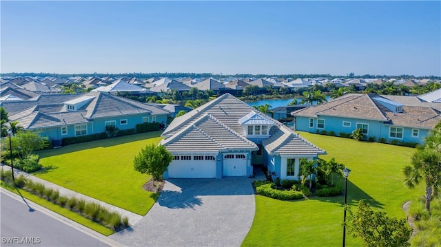 birds eye view of property featuring a water view