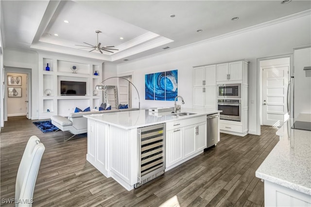 6399 Warwick Ave, Naples, FL 34113 - kitchen featuring wine cooler, a sink, stainless steel appliances, a ceiling fan, and ornamental molding