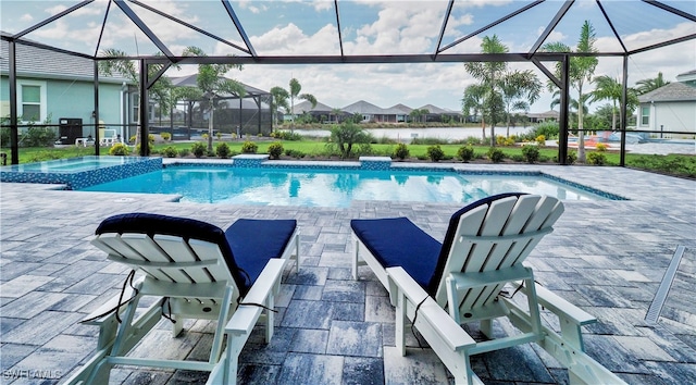 view of swimming pool with a patio, a water view, and a lanai