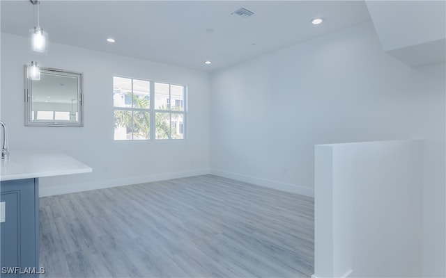 unfurnished room featuring light wood-type flooring