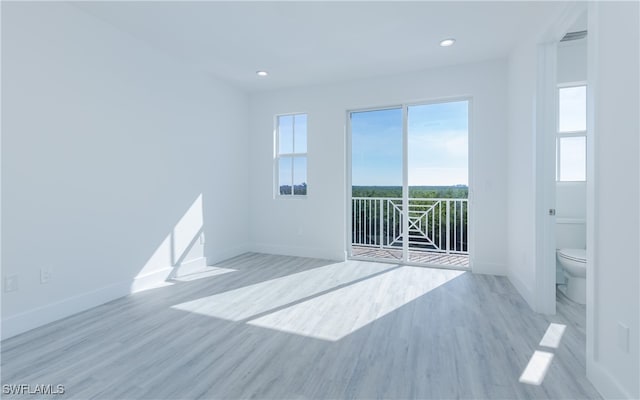 unfurnished room featuring light hardwood / wood-style floors