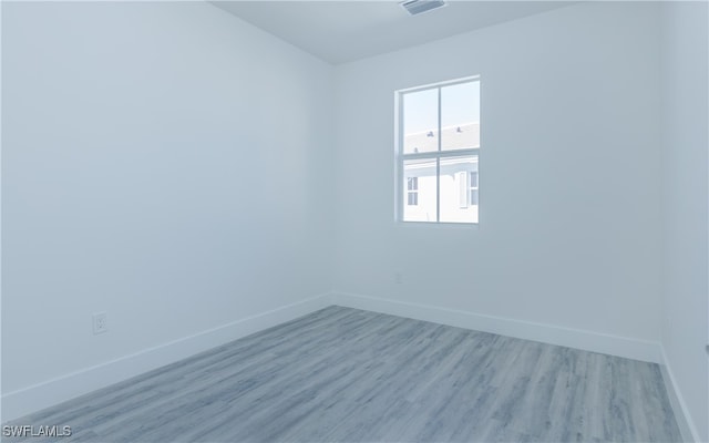 unfurnished room featuring light hardwood / wood-style flooring