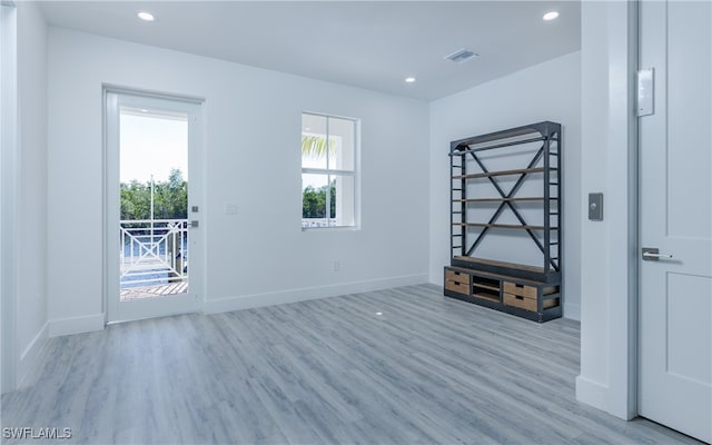 spare room with light wood-type flooring