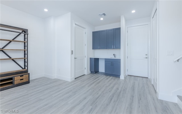 interior space featuring light hardwood / wood-style floors and sink