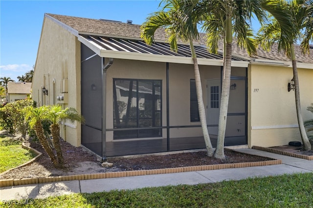 view of front of property with a sunroom