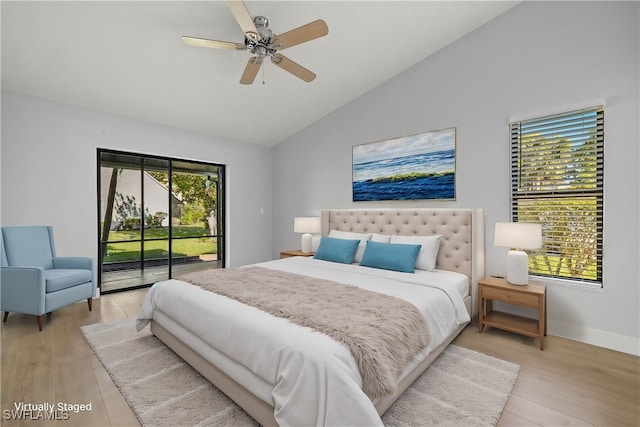 bedroom featuring ceiling fan, light hardwood / wood-style floors, access to exterior, and vaulted ceiling