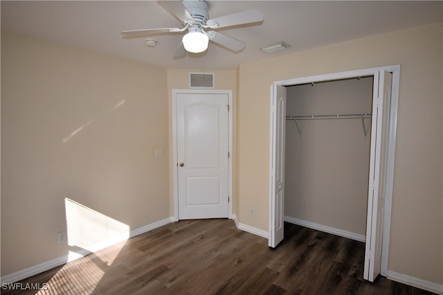 unfurnished bedroom with a closet, ceiling fan, and dark hardwood / wood-style flooring