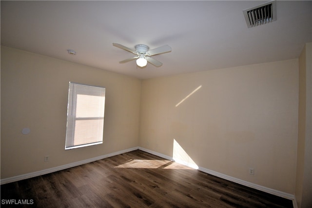 unfurnished room featuring dark hardwood / wood-style flooring and ceiling fan