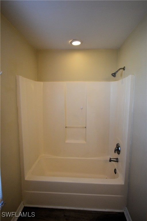 bathroom with bathing tub / shower combination