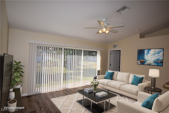 living room featuring ceiling fan, dark wood-type flooring, and vaulted ceiling