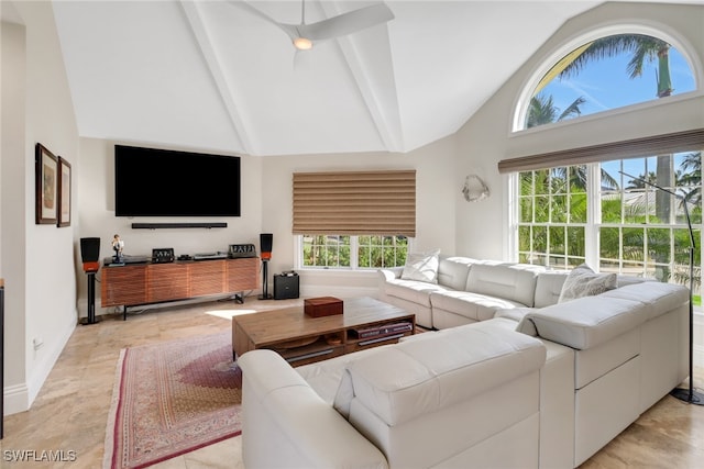 living room featuring beamed ceiling and high vaulted ceiling