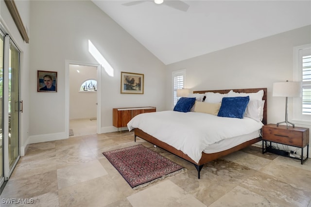 bedroom featuring ensuite bath, ceiling fan, and high vaulted ceiling