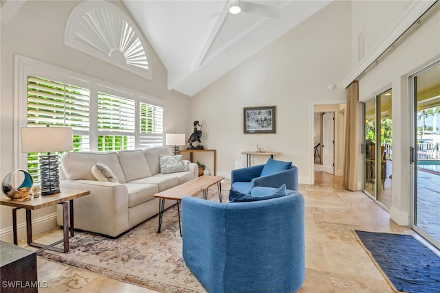 living room with beamed ceiling, high vaulted ceiling, and ceiling fan