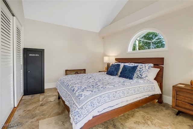 bedroom featuring a closet and lofted ceiling