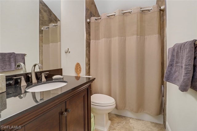 bathroom featuring walk in shower, vanity, and toilet